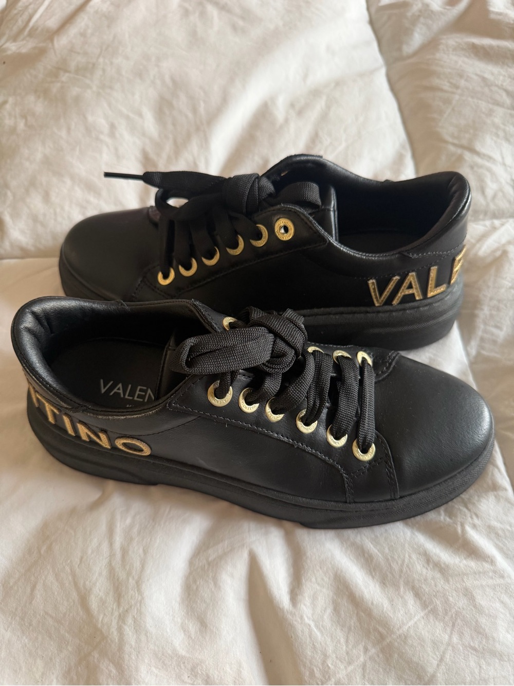 Valentino Black Leather Sneakers with Gold Eyelets and Logo